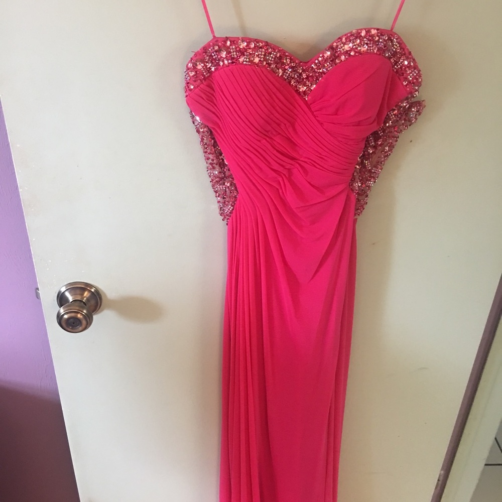 Pink prom dress with jewel detailing and cutouts